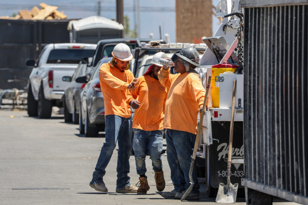 A construction crew works in extreme heat as they build homes on July 1 in Fontana, California. Credit: Robert Gauthier/Los Angeles Times via Getty Images